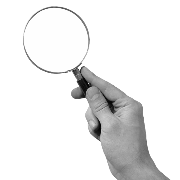 A hand holding a magnifying glass