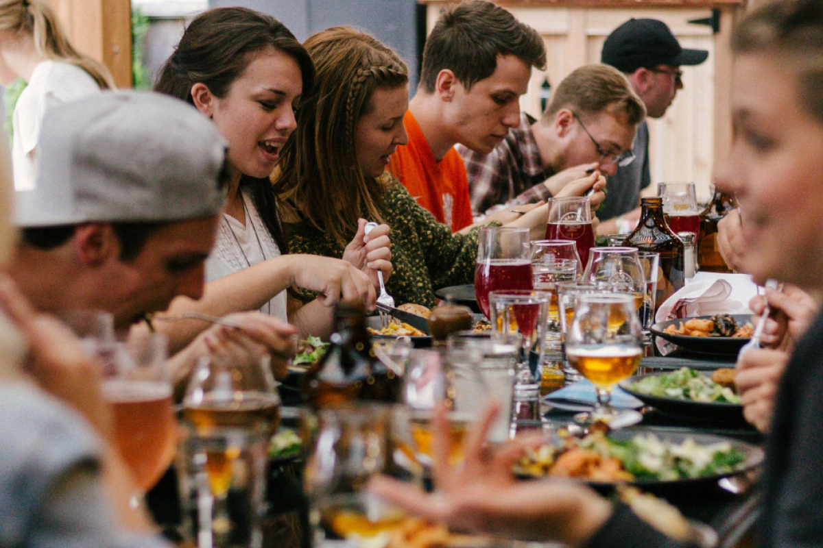 Group of people eating a meal