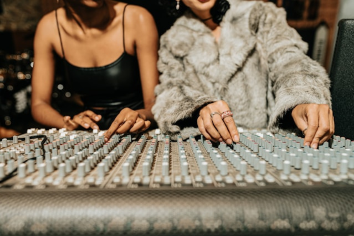Mixing board two woman using it 