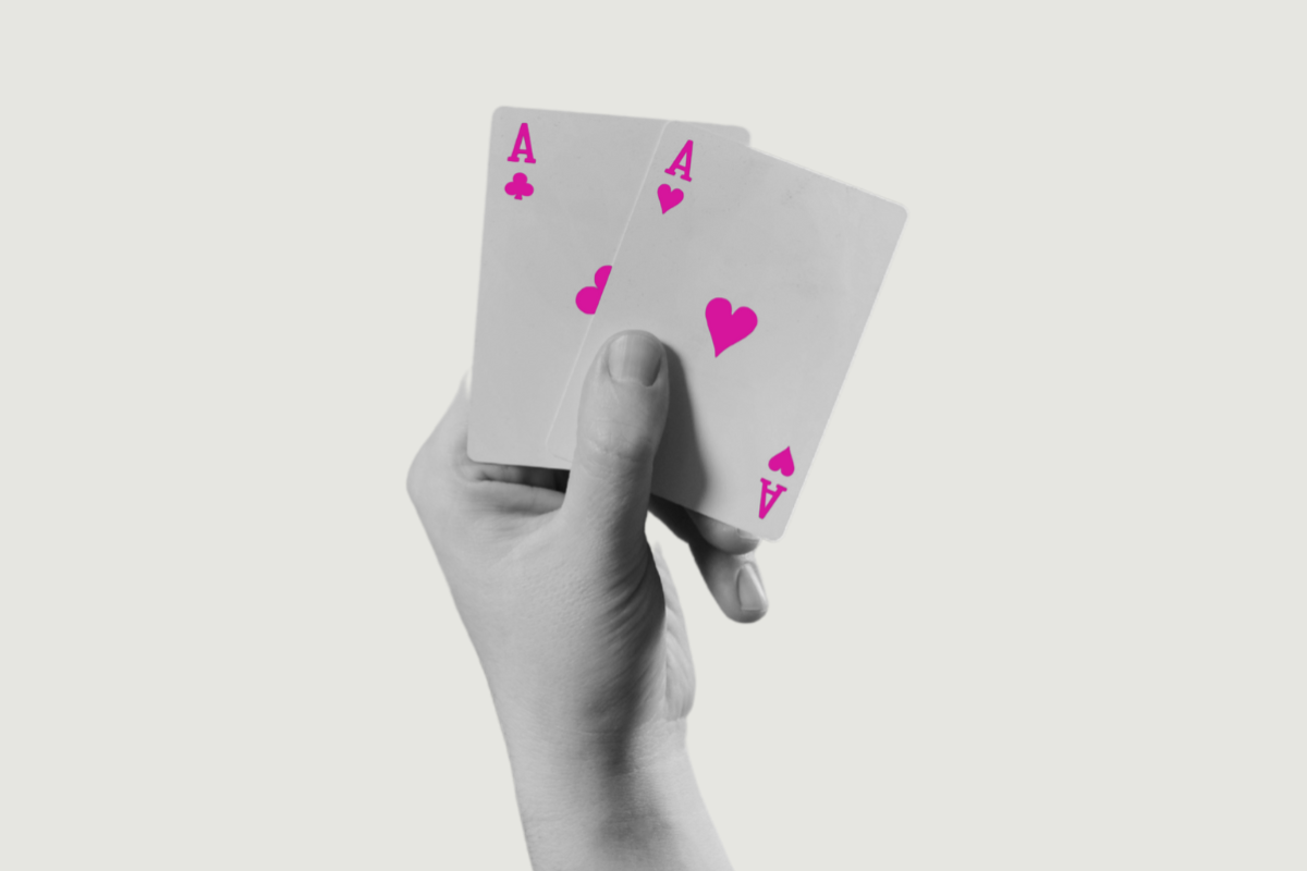 Hand holding aces
