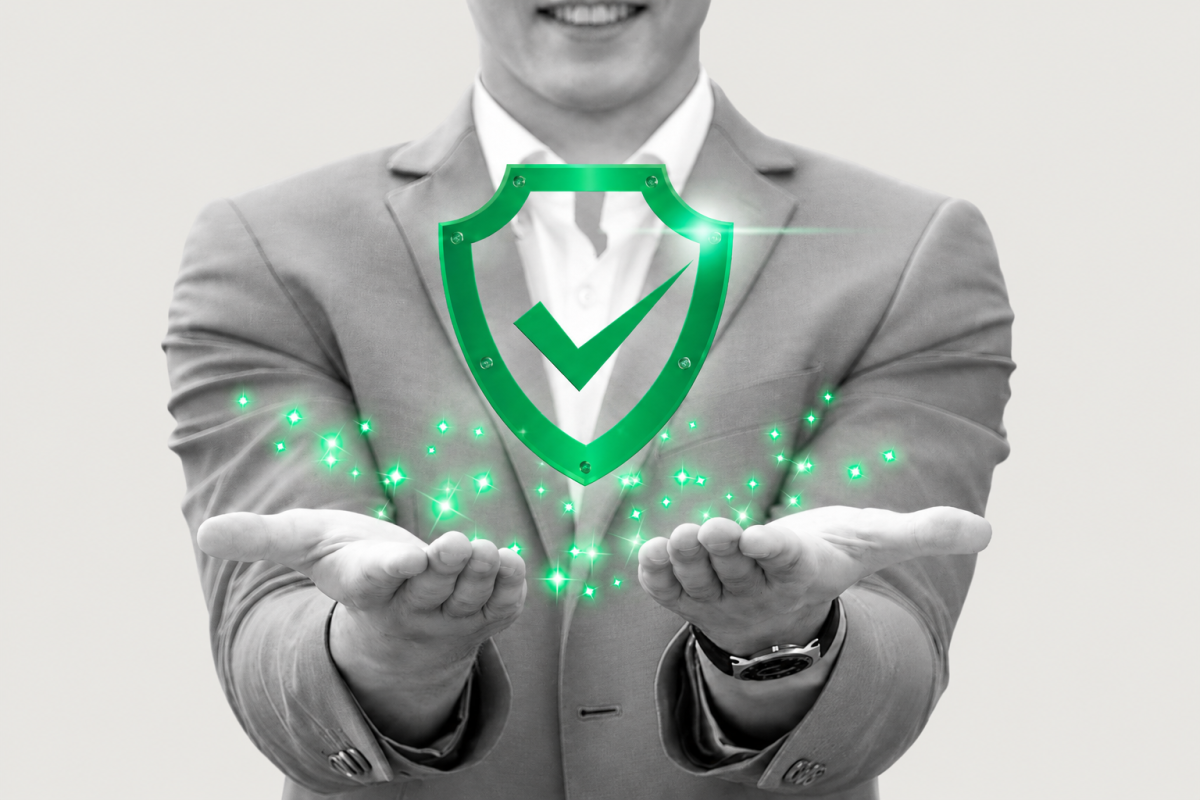 A grayscale business professional holding a bright green shield with a checkmark, surrounded by green sparkles, representing trust and assurance in an AI-driven market.