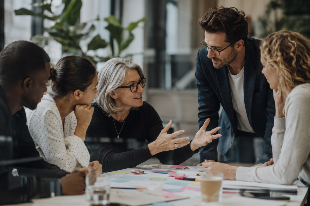 Collaborative Meeting Around a Paper-Covered Table