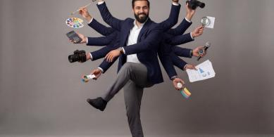 Man juggling all kind of tech