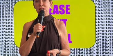 Maz Farrelly holding a mic in her session