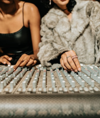 Mixing board two woman using it 